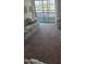 Bright living room showcasing neutral carpeting and ample natural light at 17404 N 99Th Ave # 214, Sun City, AZ 85373