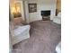 Living room showcasing neutral carpeting and ample space for seating at 17404 N 99Th Ave # 214, Sun City, AZ 85373