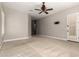 Spacious bedroom featuring neutral walls and carpet, ceiling fan, and a door leading to the outside at 17953 W Willow Dr, Goodyear, AZ 85338