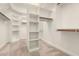 Walk-in closet offers ample storage with shelving and hanging rods at 17953 W Willow Dr, Goodyear, AZ 85338