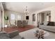 Elegant dining area featuring a chandelier and seating for six, perfect for Gathering meals and entertaining at 17953 W Willow Dr, Goodyear, AZ 85338