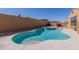 A backyard pool and spa is surrounded by desert landscaping at 17953 W Willow Dr, Goodyear, AZ 85338