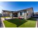 Backyard featuring artificial grass, a patio, a gazebo, and a trampoline at 18735 W San Juan Ave, Litchfield Park, AZ 85340