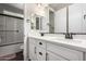 Bathroom featuring a double sink vanity with white cabinets and modern fixtures at 18735 W San Juan Ave, Litchfield Park, AZ 85340