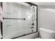 Bathroom showcasing a glass-enclosed shower with modern fixtures and a toilet at 18735 W San Juan Ave, Litchfield Park, AZ 85340