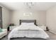 Relaxing bedroom featuring a luxurious upholstered bed and chandelier lighting, creating a cozy retreat at 18735 W San Juan Ave, Litchfield Park, AZ 85340