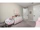 A bedroom with a whimsical aesthetic, featuring a charming dresser and a themed chair at 18735 W San Juan Ave, Litchfield Park, AZ 85340