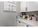 Bright countertop with white cabinets showcases ample storage and surface space perfect for organization and meal preparation at 18735 W San Juan Ave, Litchfield Park, AZ 85340