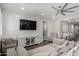 Cozy living room with a large entertainment center and comfortable seating arrangement at 18735 W San Juan Ave, Litchfield Park, AZ 85340