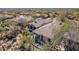 Expansive home featuring a private backyard oasis with a refreshing pool and lush desert landscaping at 20453 N 95Th Pl, Scottsdale, AZ 85255