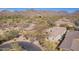 Aerial image featuring neighborhood views, a golf course, mountain views, and desert landscape at 20453 N 95Th Pl, Scottsdale, AZ 85255