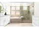 Stylish bathroom features a separate shower, soaking tub, and dual sink vanity at 20453 N 95Th Pl, Scottsdale, AZ 85255