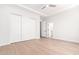 Clean, bright, empty bedroom with hardwood floors, ceiling fan, and neutral-colored walls at 20453 N 95Th Pl, Scottsdale, AZ 85255