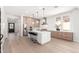Spacious kitchen with a large island, stainless steel appliances, and hardwood floors throughout at 20453 N 95Th Pl, Scottsdale, AZ 85255