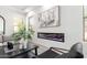 Electric fireplace with color features with large artwork at 20453 N 95Th Pl, Scottsdale, AZ 85255