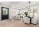 Bright living space with modern furnishings, hardwood floors, and lots of natural light from large windows at 20453 N 95Th Pl, Scottsdale, AZ 85255