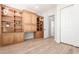 Spacious office featuring custom built-in wooden cabinets and drawers at 20453 N 95Th Pl, Scottsdale, AZ 85255