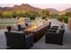Inviting outdoor fireplace lounge area, perfect for entertaining with mountain views at 20453 N 95Th Pl, Scottsdale, AZ 85255