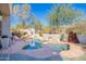 Resort-style pool and spa with stone accents and beautiful landscaping for relaxation at 20453 N 95Th Pl, Scottsdale, AZ 85255