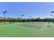 Community tennis courts with pristine green surface, surrounded by desert vegetation at 20453 N 95Th Pl, Scottsdale, AZ 85255