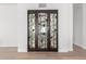Ornate iron door to the wine cellar adds a luxurious touch at 20453 N 95Th Pl, Scottsdale, AZ 85255