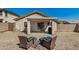 Relaxing backyard patio with comfortable seating and a covered area for entertaining at 21941 W Solano Dr, Buckeye, AZ 85326