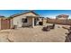This home includes a covered patio with a bbq in the low-maintenance backyard at 21941 W Solano Dr, Buckeye, AZ 85326
