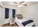 Bright bedroom with ceiling fan and natural light at 21941 W Solano Dr, Buckeye, AZ 85326