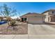 Charming single-Gathering home with a two-car garage and low-maintenance desert landscaping at 21941 W Solano Dr, Buckeye, AZ 85326