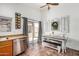 Bright kitchen with a dining area and stainless steel dishwasher at 21941 W Solano Dr, Buckeye, AZ 85326