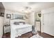 Comfortable main bedroom with white ceiling fan and rustic wood accents at 21941 W Solano Dr, Buckeye, AZ 85326