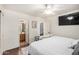 View of main bedroom and ensuite bathroom with wood-look floors at 21941 W Solano Dr, Buckeye, AZ 85326