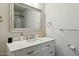 Bathroom featuring a large framed mirror, white vanity with ample storage, and updated fixtures at 2253 S Emerson --, Mesa, AZ 85210