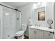 Bright bathroom featuring a walk-in shower, tile floor, white vanity, and modern fixtures at 2253 S Emerson --, Mesa, AZ 85210