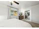 Bright main bedroom with a ceiling fan, large window, and mirrored closet doors at 2253 S Emerson --, Mesa, AZ 85210