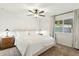 Bedroom features a queen bed with a white comforter and a large window offering plenty of light at 2253 S Emerson --, Mesa, AZ 85210