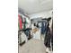 Spacious walk-in closet provides ample storage with rods, shelving, and carpeted floor at 2253 S Emerson --, Mesa, AZ 85210