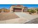 Charming single-story home featuring a two-car garage and low-maintenance desert landscaping at 23740 W Hilton St, Buckeye, AZ 85326