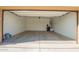 The spacious two-car garage features epoxy flooring and plenty of storage space at 23740 W Hilton St, Buckeye, AZ 85326