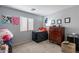 Guest bedroom with modern artwork and neutral carpet at 2573 S Powell Rd, Apache Junction, AZ 85119