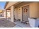 A welcoming front porch with a decorative wreath and a seating area at 2573 S Powell Rd, Apache Junction, AZ 85119