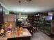 Spacious living room with dining area featuring neutral color walls, tile flooring, and recessed lighting at 28 E Winged Foot Rd, Phoenix, AZ 85022