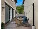 Inviting back patio features a cozy seating area and charming string lights at 29031 N 125Th Ln, Peoria, AZ 85383