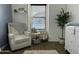 Charming Bedroom with a glider, changing table, and stylish decor at 29031 N 125Th Ln, Peoria, AZ 85383
