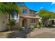 Charming two-story home with a tile roof, a covered porch and landscaped front yard at 29031 N 125Th Ln, Peoria, AZ 85383