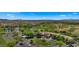 Scenic aerial view of the golf course and clubhouse in a desert setting at 29031 N 125Th Ln, Peoria, AZ 85383