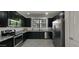Modern kitchen featuring stainless steel appliances, dark cabinetry and gray countertops at 29031 N 125Th Ln, Peoria, AZ 85383