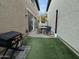 Outdoor living space with patio and artificial turf at 29031 N 125Th Ln, Peoria, AZ 85383