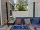 Charming outdoor patio area with comfortable seating, fire pit, and stylish decor at 29031 N 125Th Ln, Peoria, AZ 85383