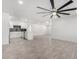 Spacious living room leading to the kitchen with wood-look flooring and fresh neutral paint at 3029 W Windrose Dr, Phoenix, AZ 85029